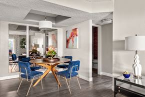 Las Vegas apartment for rent - a dining area with a wooden table and blue chairs
